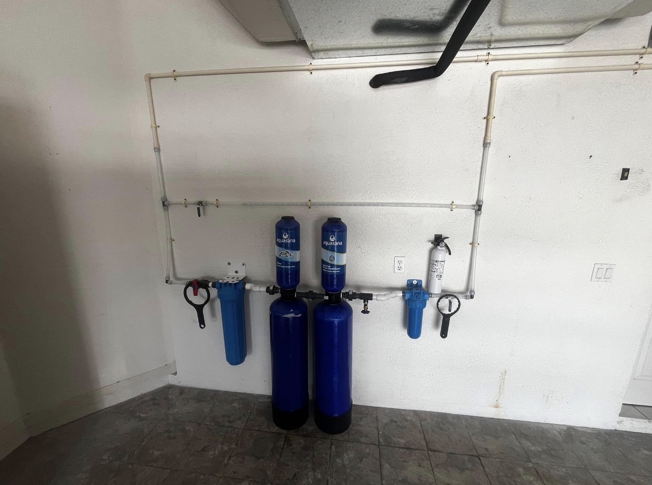 Whole-home water filtration system installed by Powells Plumbing